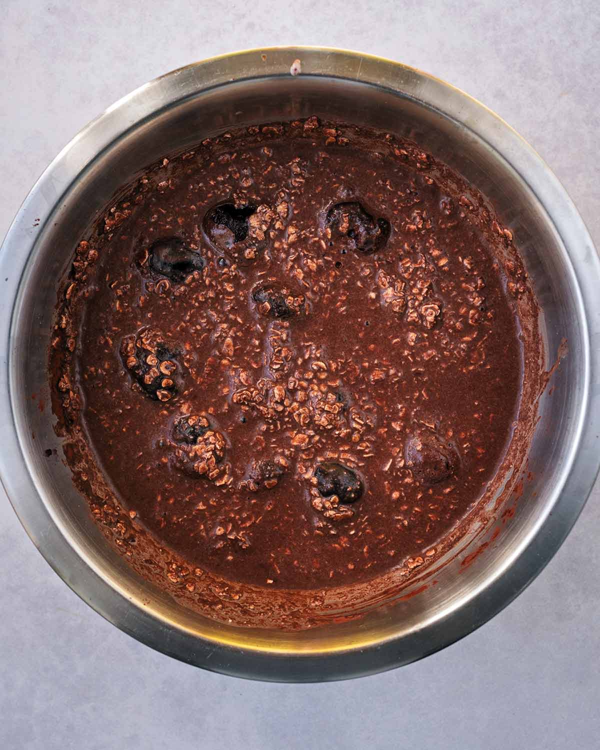 Everything mixed in the bowl and frozen cherries added to the mixture.