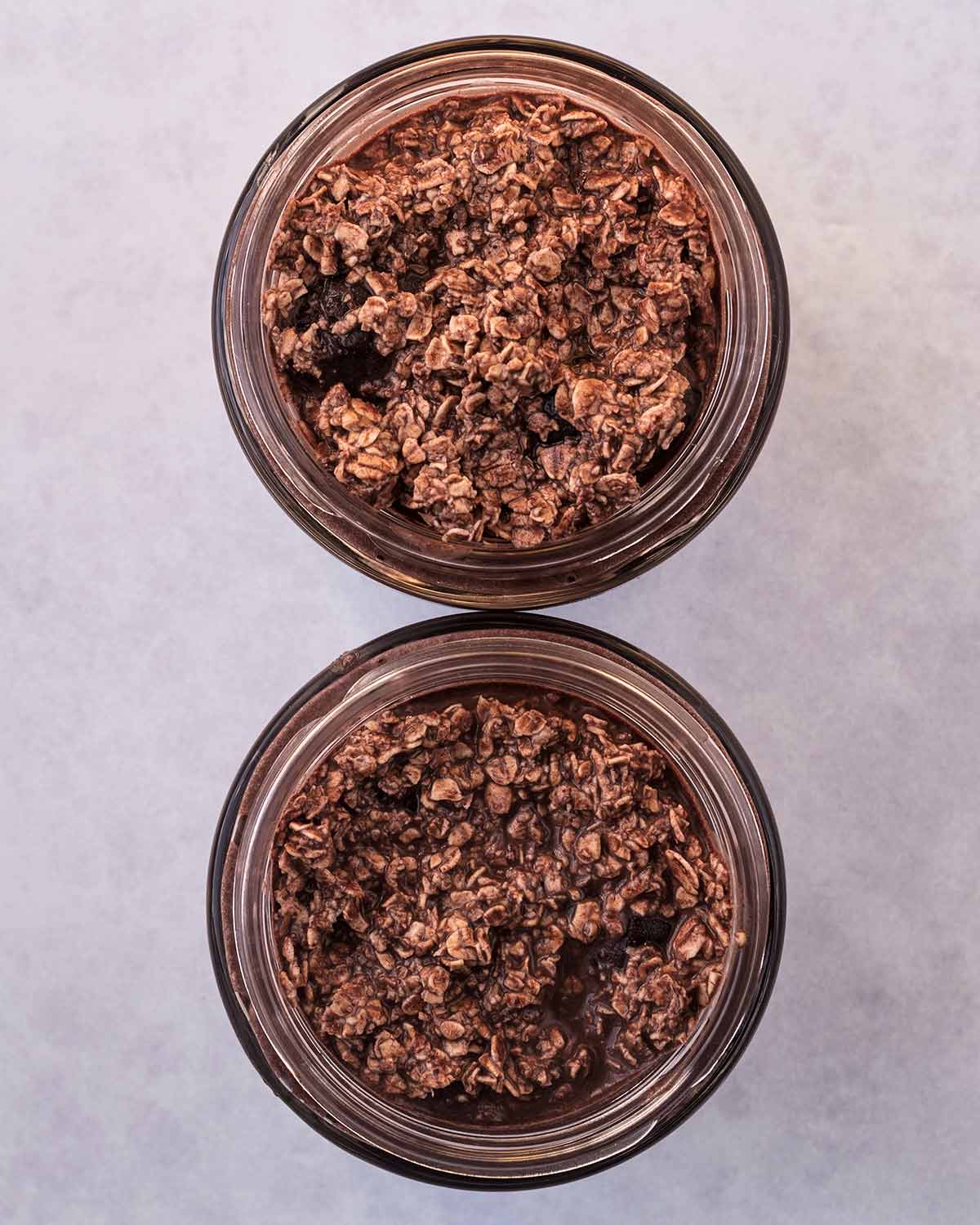 The oat mixture divided between two glass jars.