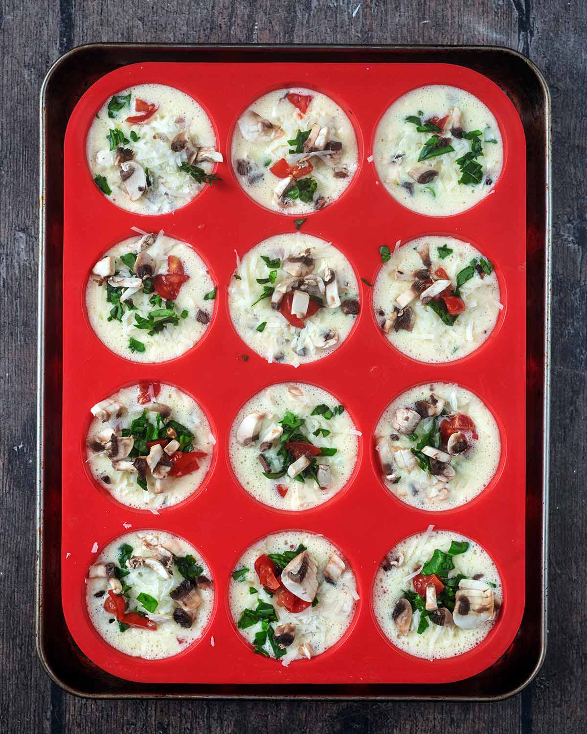 The egg mixture poured into each of the miffin holes.
