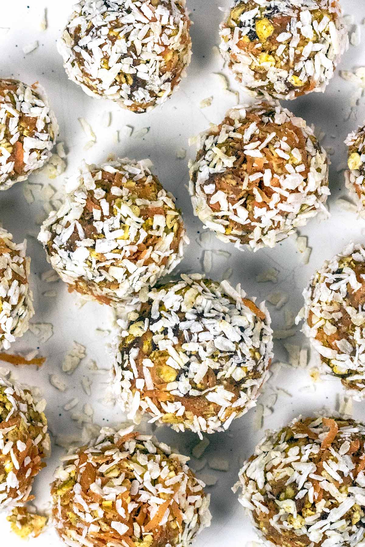 Carrot cake balls rolled in desiccated coconut.