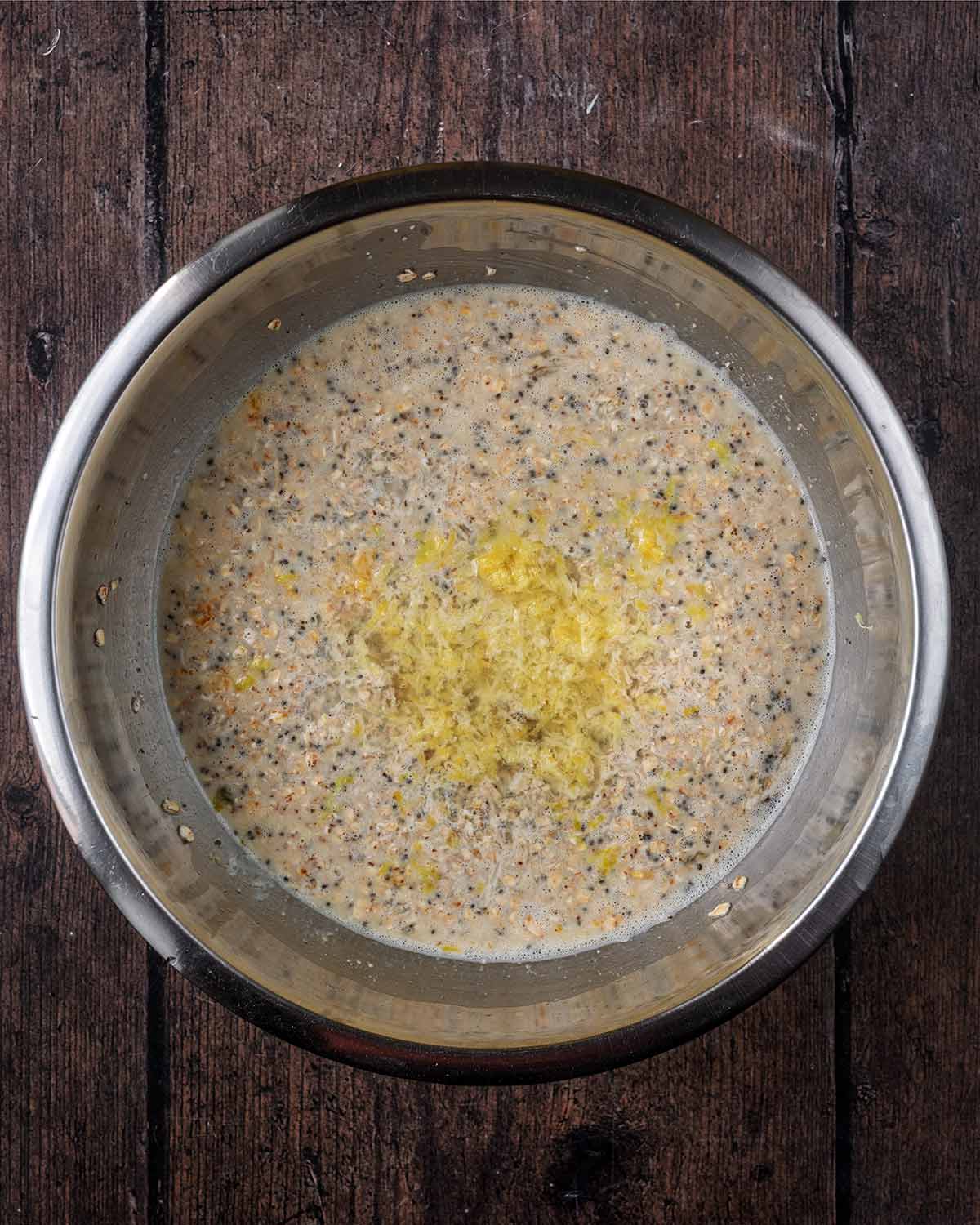 Milk, eggs, lemon zest and maple syrup added to the bowl.