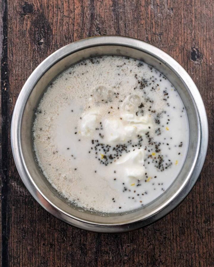 Milk, yogurt, chia seeds and lemon zest in a mixing bowl.