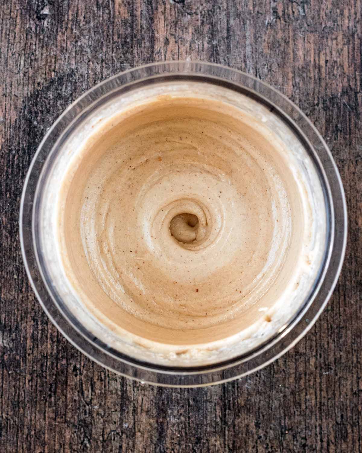The frozen tub processed into a creamy consistency.