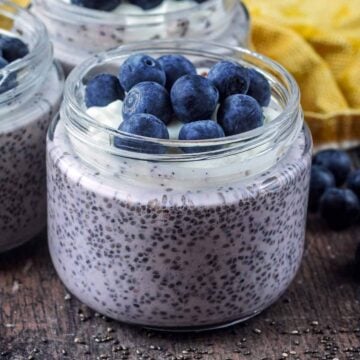Blueberry chia pudding in a small glass jar.