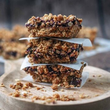 Three blueberry oat bars stacked up.