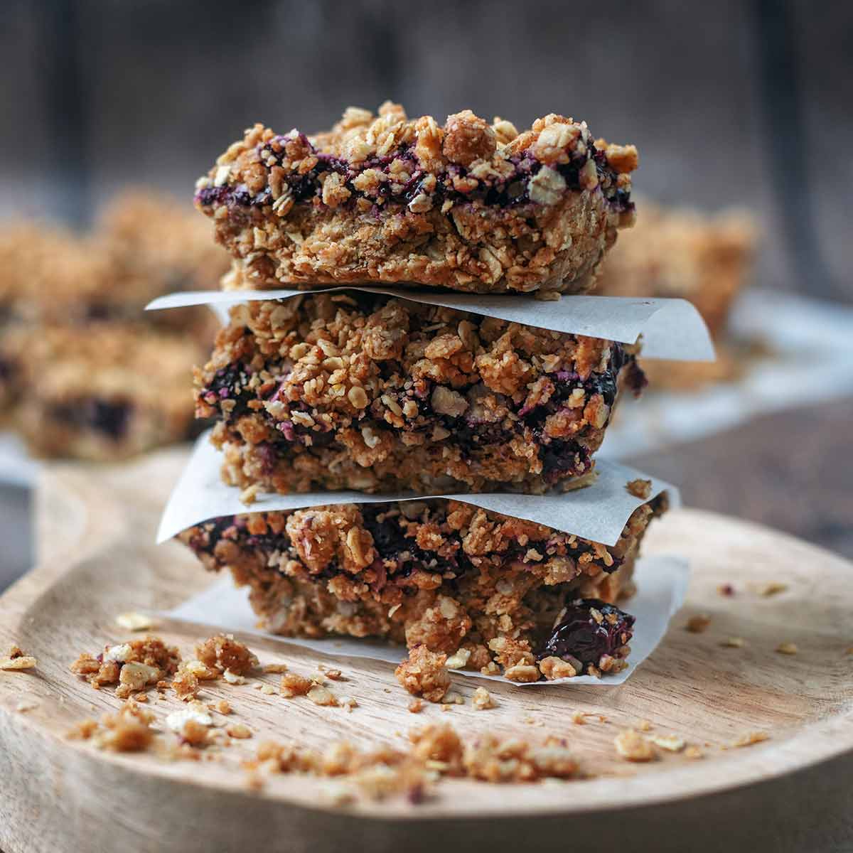 Three blueberry oat bars stacked up.