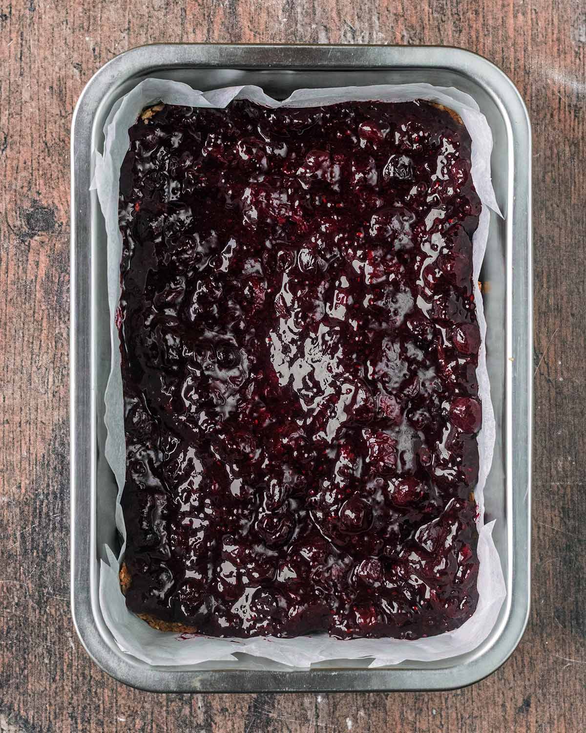 Blueberry jam spread over the oats.