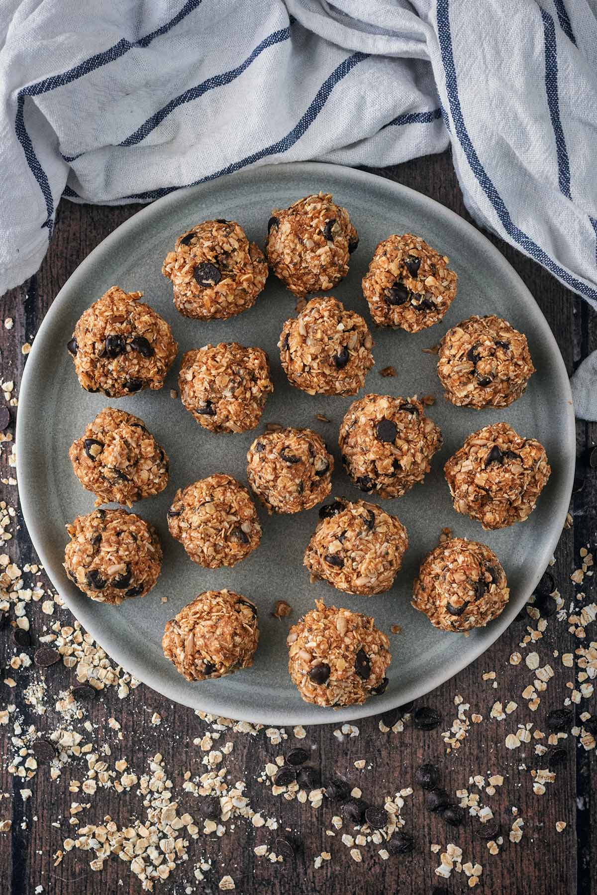 A plate full of chocolate chip oat balls.