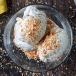Ninja Creami coconut ice cream topped with toasted coconut.