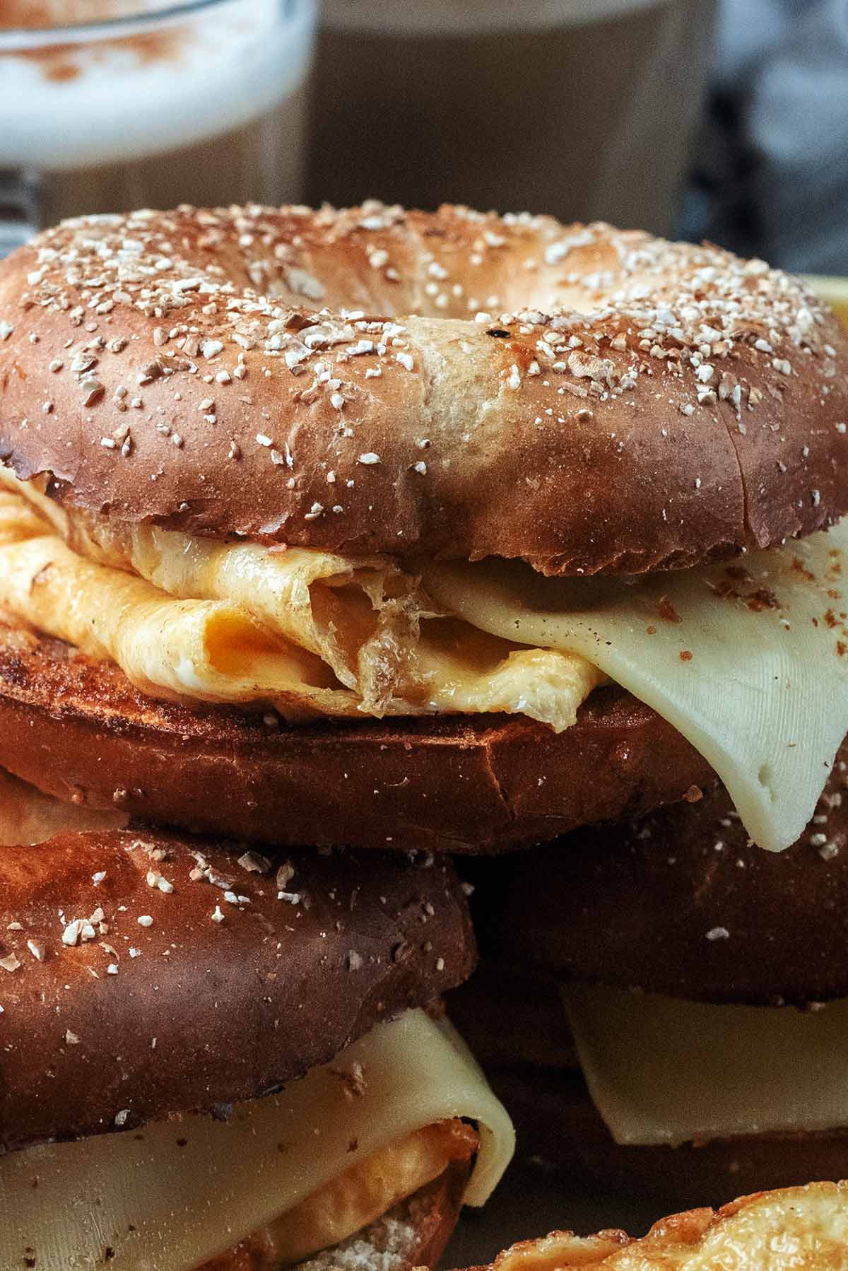 Egg and cheese filling of a toasted bagel.