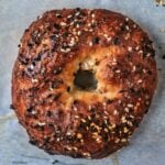 A greek yogurt bagel topped with sesame seeds.