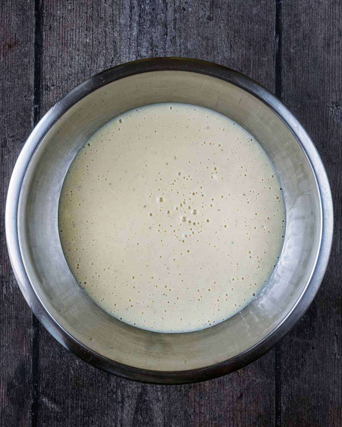 The blended mixture poured into a mixing bowl.