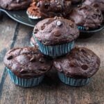 Three high protein greek yogurt chocolate muffins stacked up.