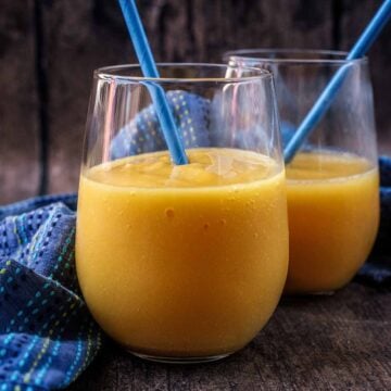 Two glasses of mango passionfruit cooler.