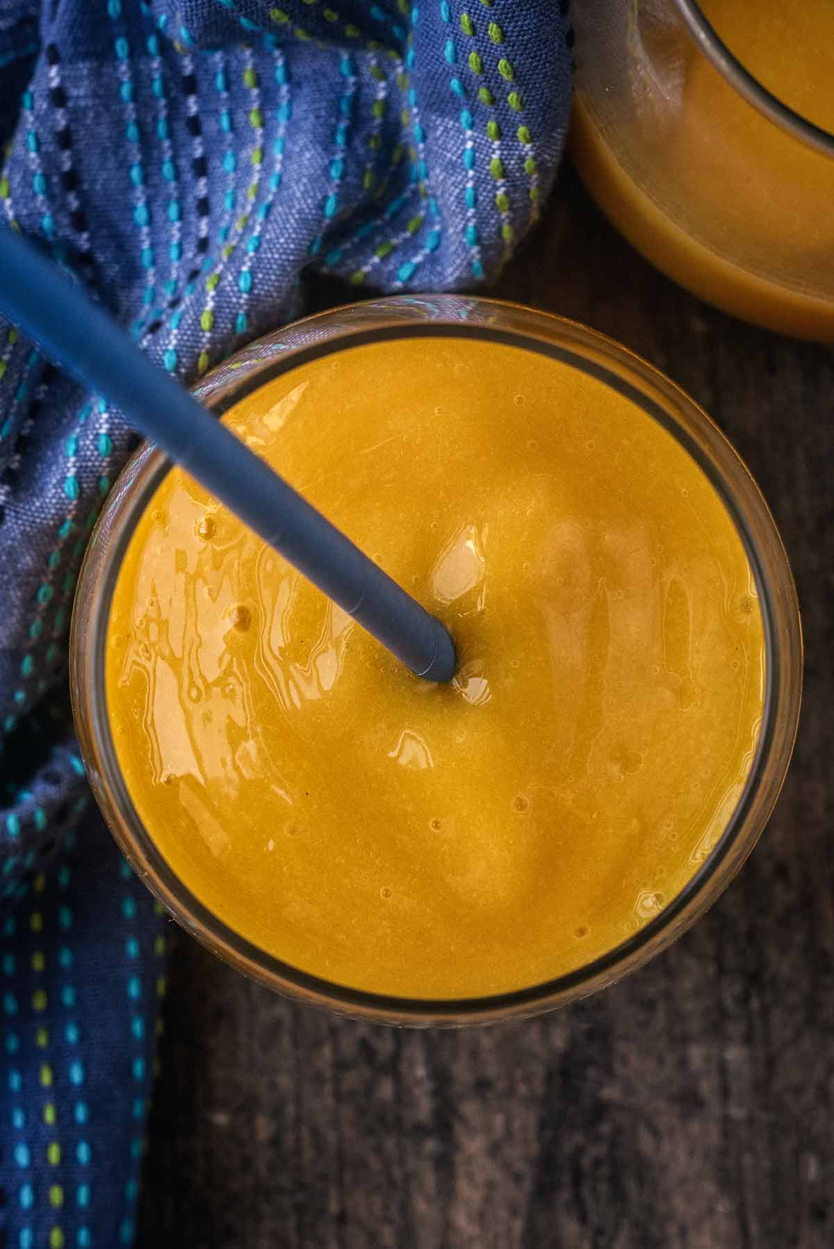 A glass of mango cooler as viewed from above.