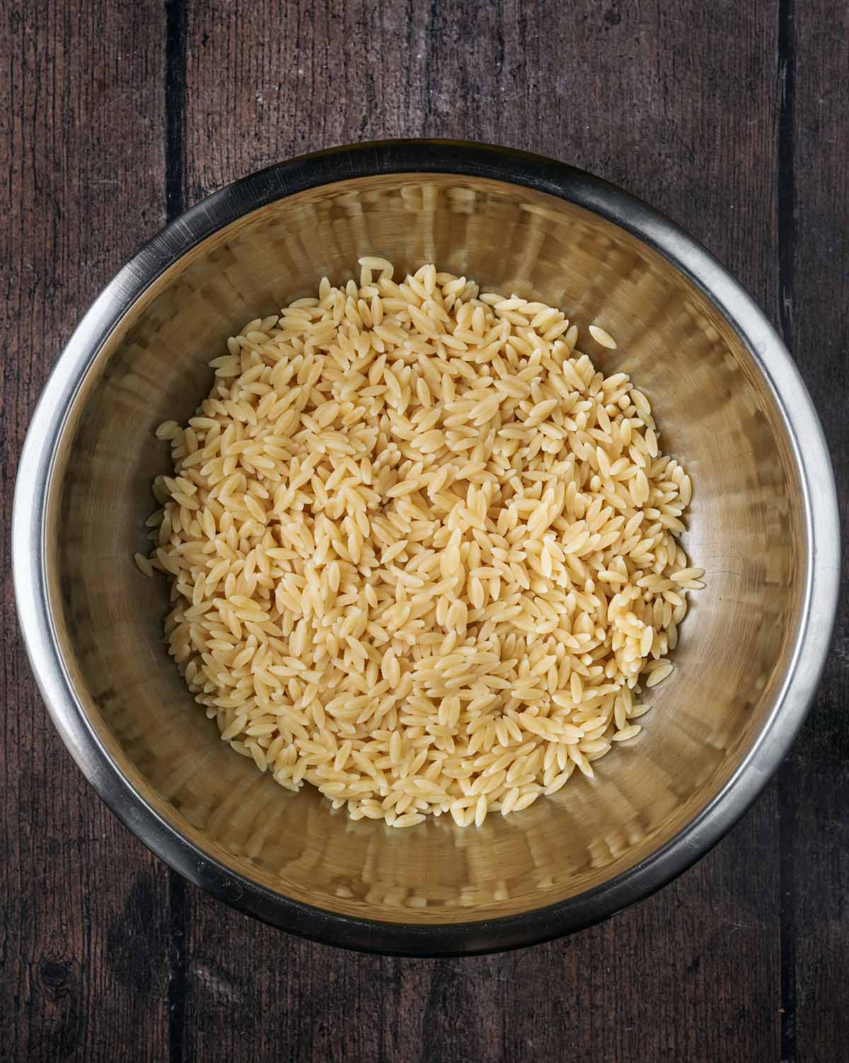 Cooked orzo in a large mixing bowl.