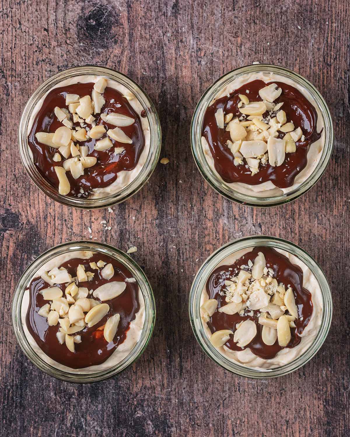 Melted chocolate and chopped peanuts added to the top of the yogurt.