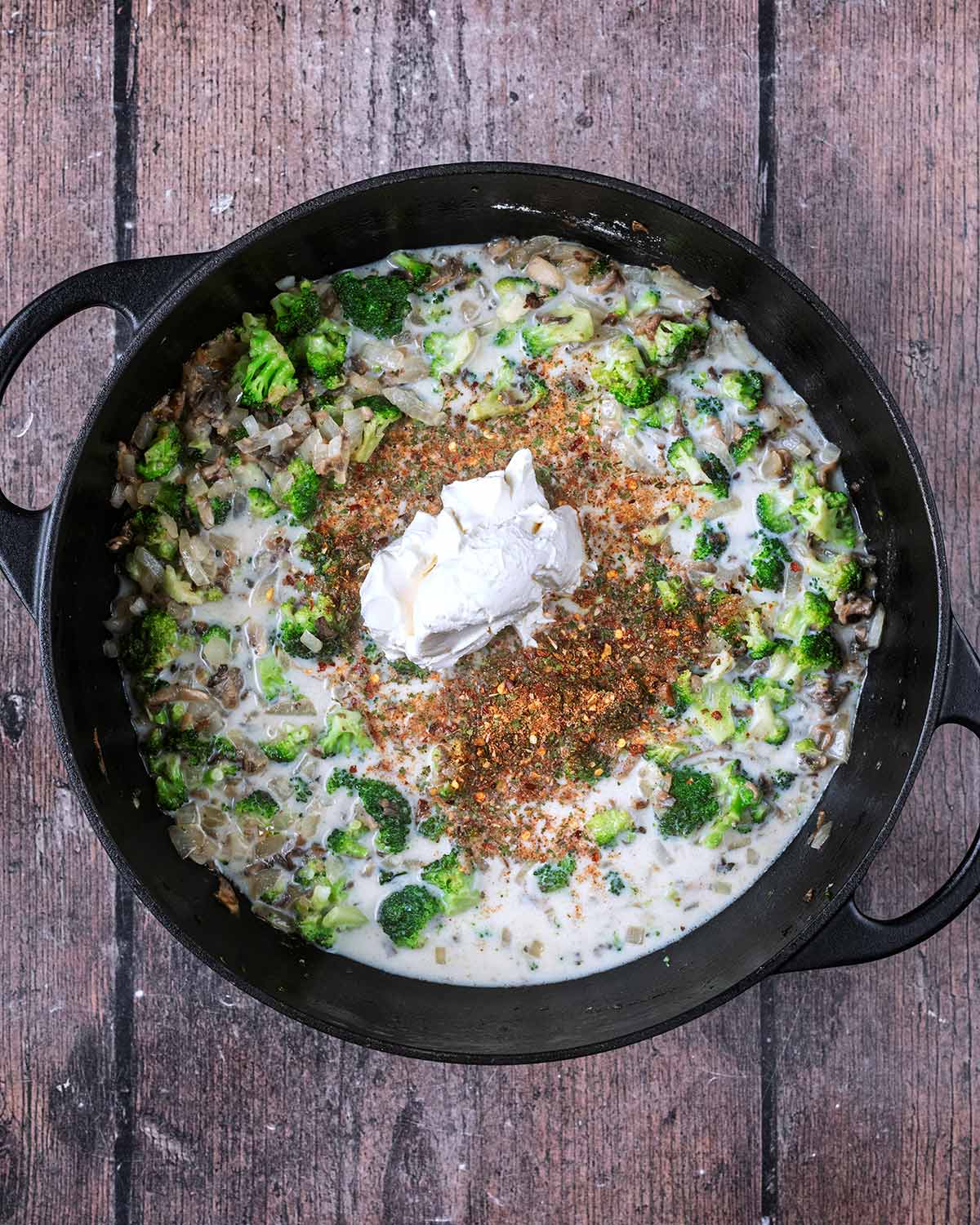 Stock, milk, cream cheese and seasoning added to the pan.