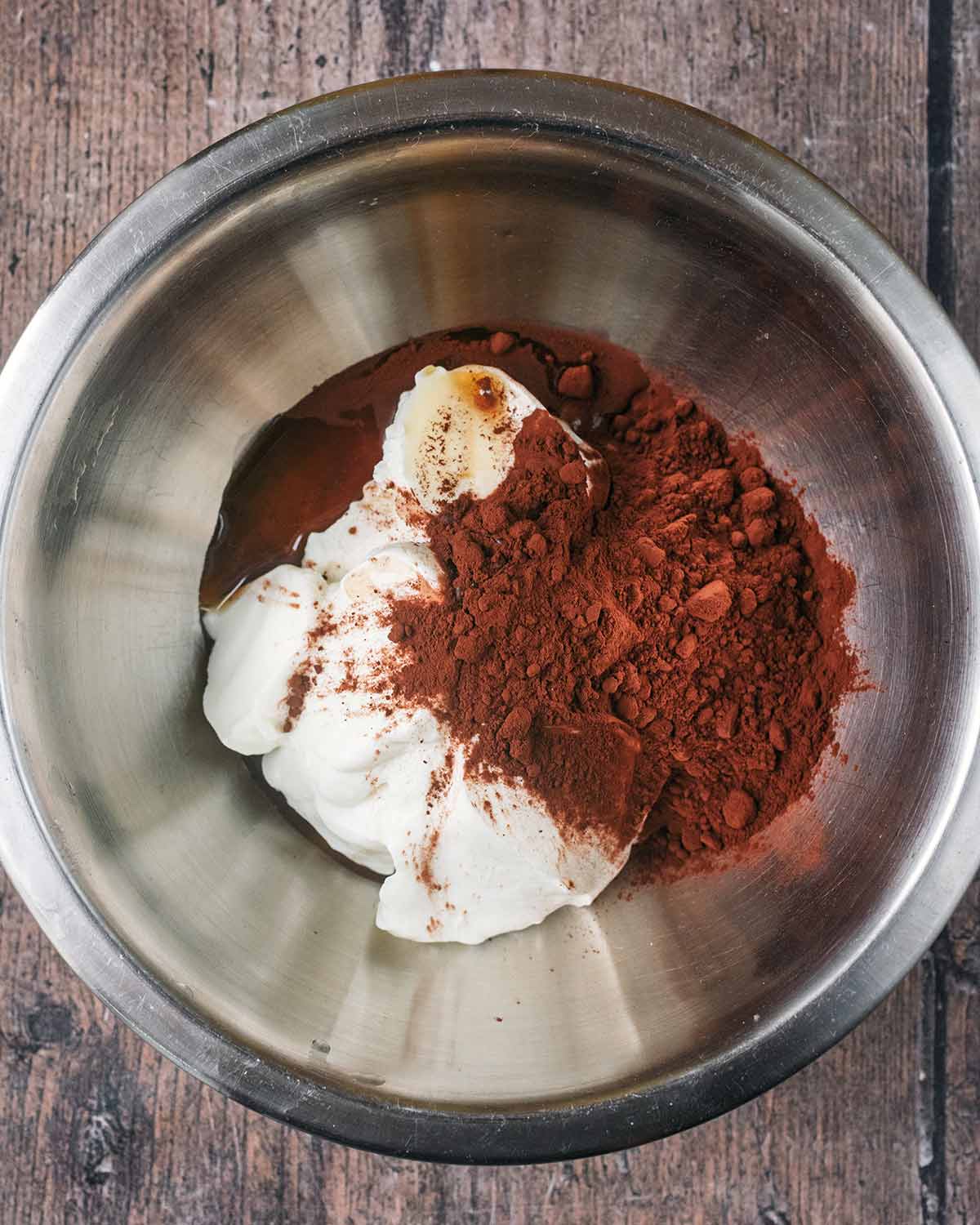 Yogurt and cocoa powder in a mixing bowl.
