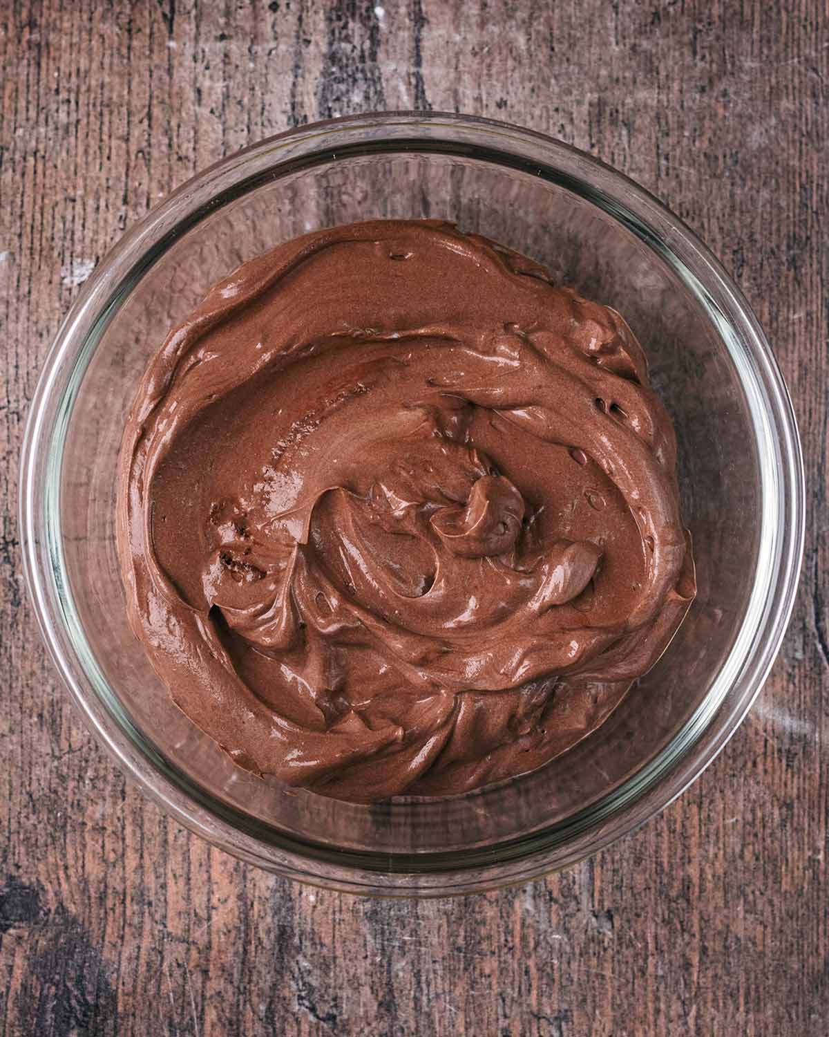 Chocolate yogurt in a glass container.