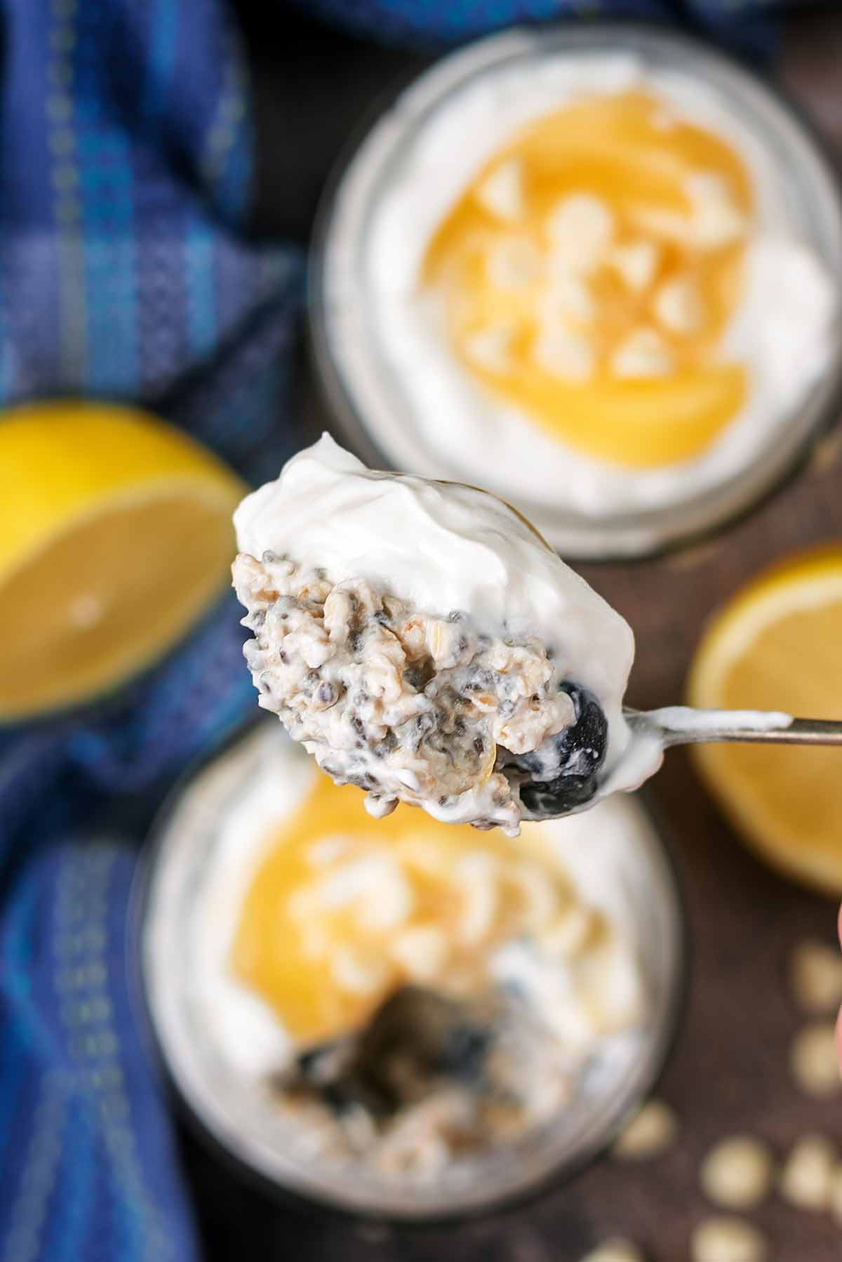 A spoonful of overnight oats above the jar it came from.