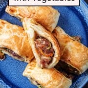 Sausage rolls with vegetables with a text overlay title.