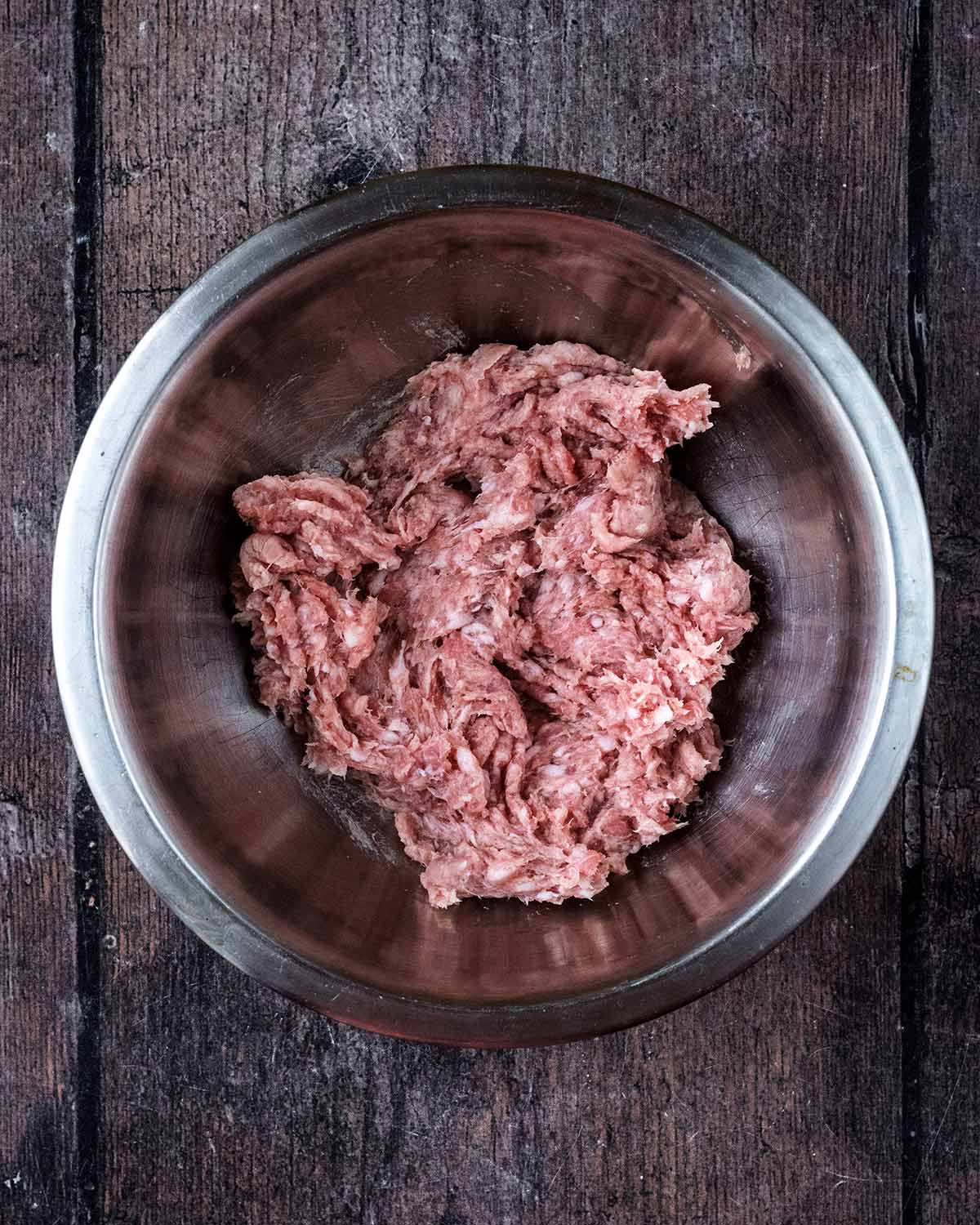 Sausage meat in a mixing bowl.