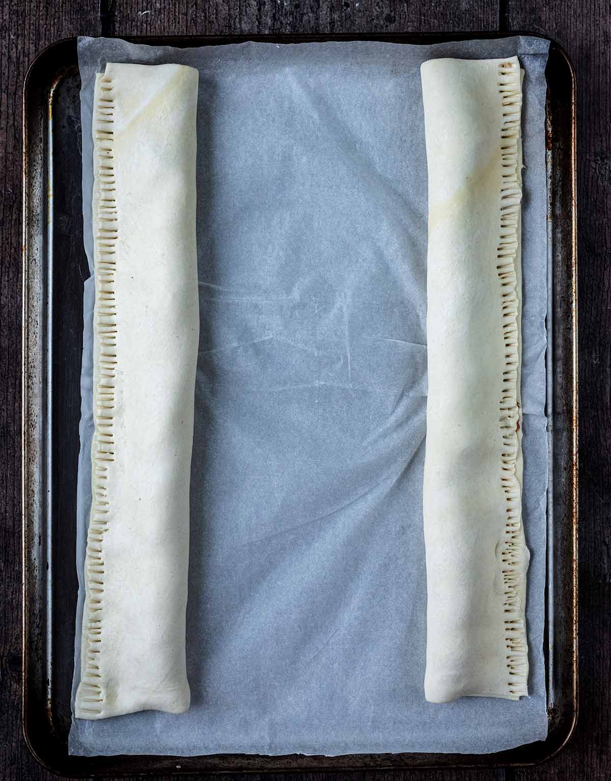 The pastry folded over the mixture to form two long rolls.