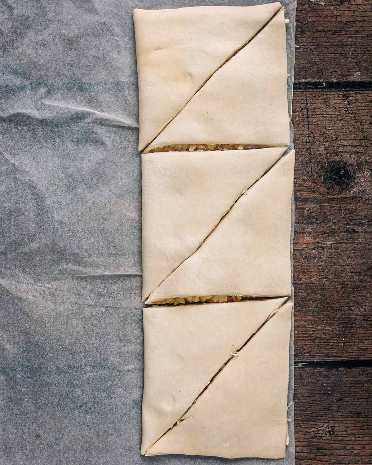 The pastry folded over and cut into six triangles.