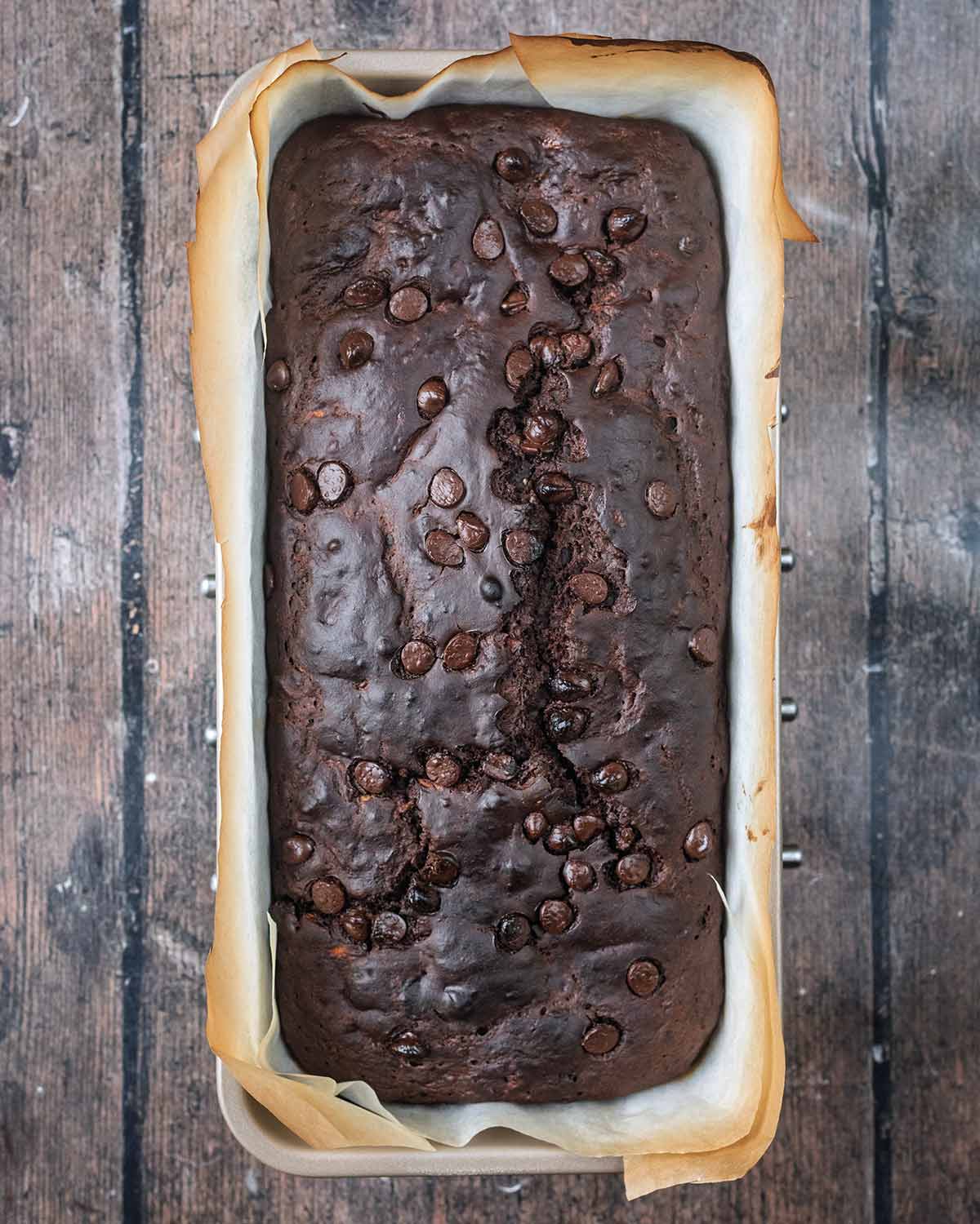 The cooked chocolate courgette loaf cake, cooling in the tin.